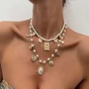 S56af11176ec04f75ba393dfe306baf31R.webp Vintage Allure Pearl Charm Layered Necklace