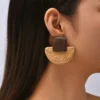 S5c27552681cb4d8fbc389e7a29ddd185r.webp Sojourn Woven Square Top Boho Rattan Earrings