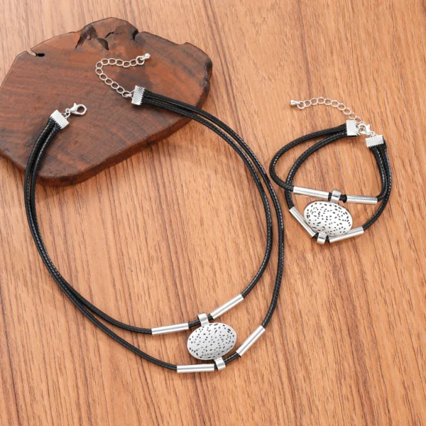 S5cb2feae56b74c1e9afe10a62a7148bbI.webp Earthbound Textured Pendant Necklace and Bracelet Set