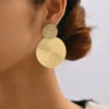 S5dbd819c6ce54990bf8c92f48418814bR.webp Golden Mirage Textured Disc Statement Earrings
