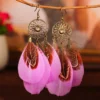 S6296ad3e2cf0493baed79f64c3c41e8fD.webp Nomad Sun Feather Dreamcatcher Statement Earrings