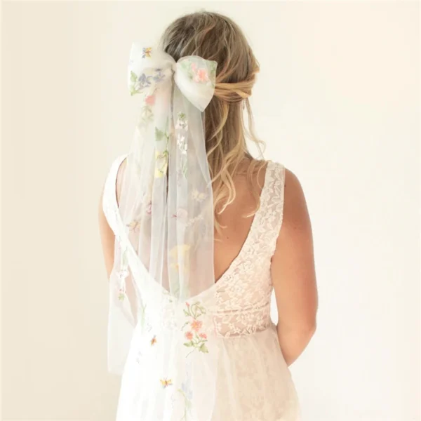 S62d79e9df778499eb112f47c99c0bcadp.webp Romantic Whispers Bow Veil With Comb featured in Floral Embroidery
