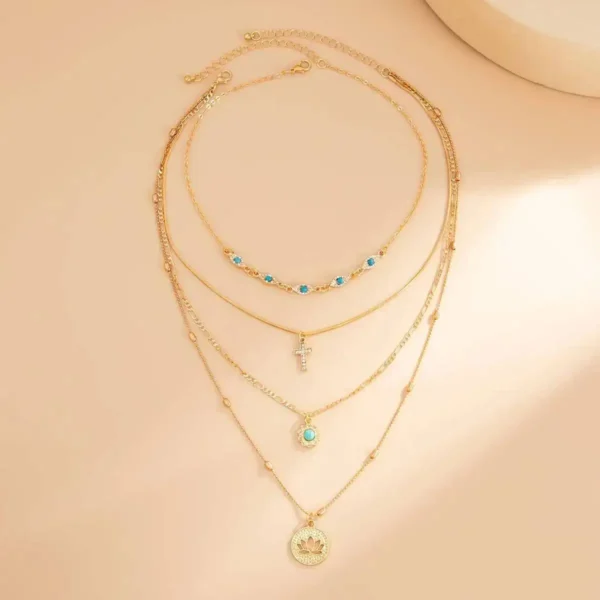 S68a5d86ea97d46b28d970e4969bf1bf16.webp Elements Lost and Found Gold Layered Necklace with Turquoise Details