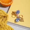 S6b953d2170dc457fa1a269c7a60f2e6f8.webp Amour Porcelain Heart Charm Hoop Earrings