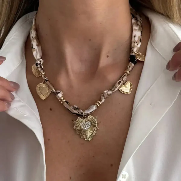 S7292cdfaedde4140a4f6ac8da0f6ea29e.webp Romantic Serenade Necklace Gold Heart Charm with Animal Print Ribbon