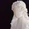 The Elsie Cap, a cream white juliet cap veil with 3D fabric flowers, pearls and a lace-edged tulle veil
