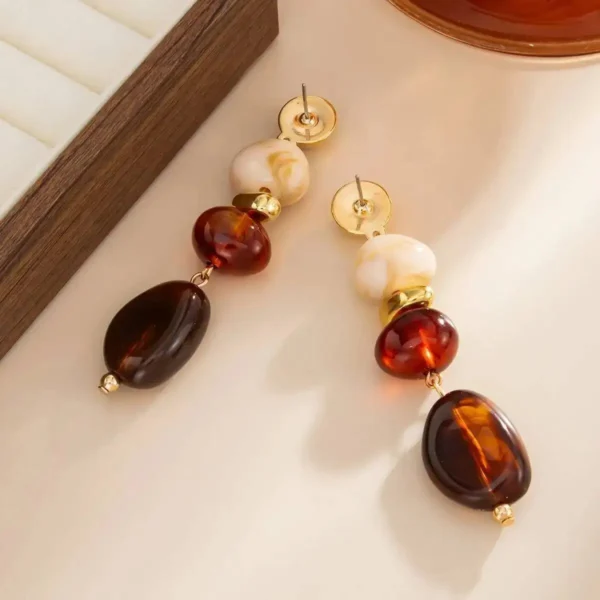 S7bcdcba643b141879eb196f0e62a8a324.webp Boho Earrings with Bold Stone Accents and Gold Highlights