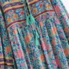S7bf6622e655541b98b008c2b969ac2aeB.webp Wilderness Boho Floral Bohemian Dress with Tassels and Tie-Front