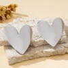 S7d383dbd8d76407b9c65c70397da1907E.webp Sculpted Heart Statement Earrings
