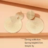 S7d62c69caea3461fa66b4d2fef5d8be4o.webp Golden Mirage Textured Disc Statement Earrings