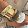S800b5dcc932c45109ef066e8139ccc25X.webp Urban Edge Modern Chunky Bangles Set in Textured Metal and Resin