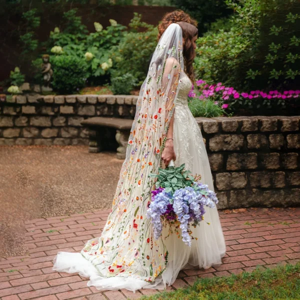 S8296a26c992d4a329e4211fd9ef61293I.webp The Honeyblossom Veil, a wildflower wedding veil embroidered all over with poppies, daisies and ferns