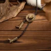S839e7833903d45c8b53eee6c126a3969u.webp Frontier Adventure Western Bolo Tie with Hat and Boot Accents