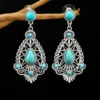 S8532369823d24ecfbf98a7d8f6f733d65.webp Intricate Silver Boho Earrings with Turquoise Accents