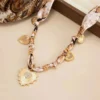 S85bba7726cee4bbfb669dd52b08b40420.webp Romantic Serenade Necklace Gold Heart Charm with Animal Print Ribbon