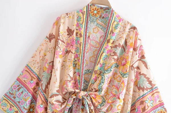 S864d7c20a4424d36b459c9cf202a3dd6A.webp Adventure Awaits Batwing Boho Kimono with Ties and Vibrant Patterns