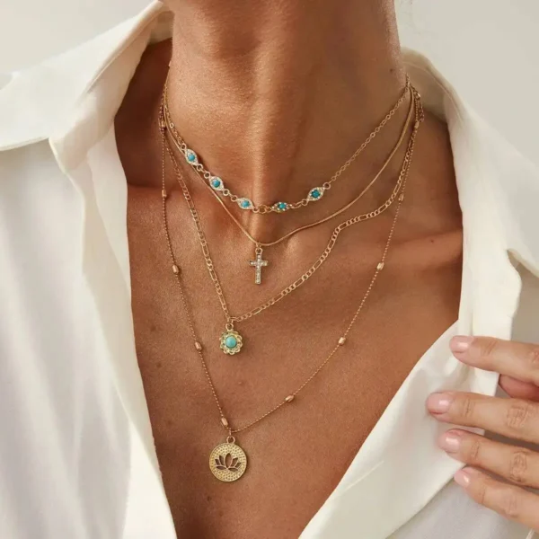 S8a371811b7c64b22a6a65b534fffd146z.webp Elements Lost and Found Gold Layered Necklace with Turquoise Details