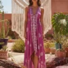 S90be41ca38334891839c7c304a393433z.webp Desert Bloom: Floral Print Backless Halter Maxi with Tassel Hem