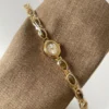 S921090d28b0445b08f35063f7710678cV.webp Elysian Gemstone Embellished Wristwatch with Bracelet Strap