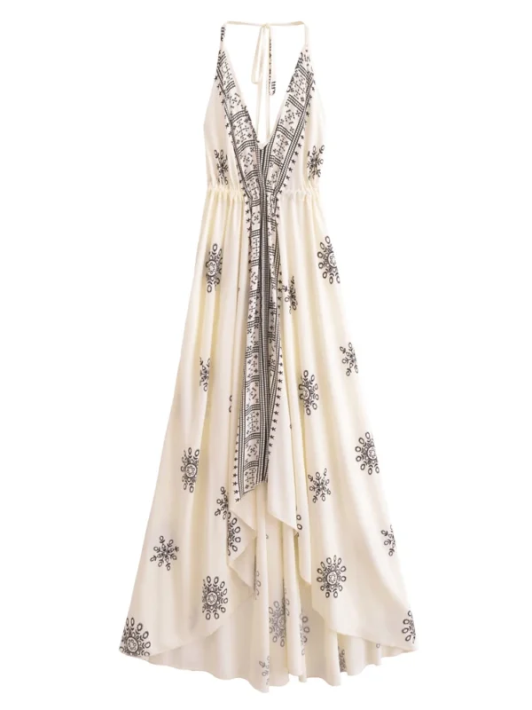 S94df8e4ab4414589be12d3a622c957abu.webp Desert Bloom: Floral Print Backless Halter Maxi with Tassel Hem