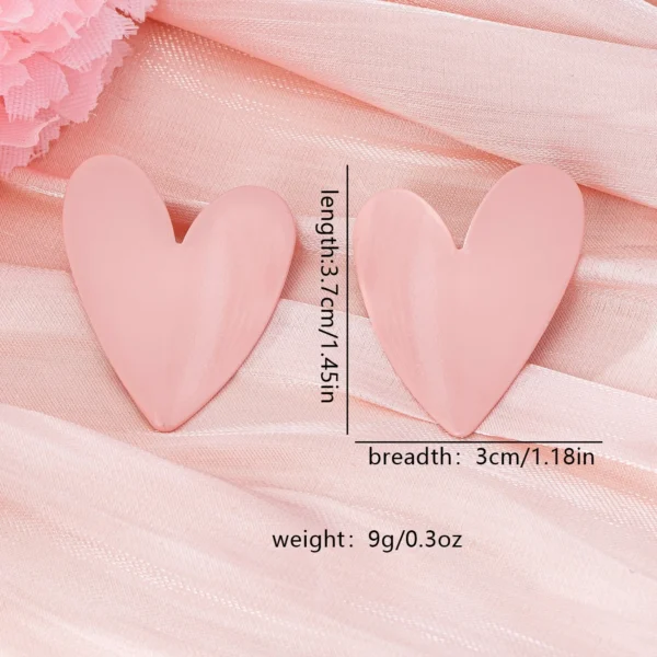 S94eef9a51dd04bf68f3575b20b1cf3c00.webp Sculpted Heart Statement Earrings