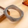 S9acc93c410a14e07ba5e4125a63de4deq.webp Urban Edge Modern Chunky Bangles Set in Textured Metal and Resin