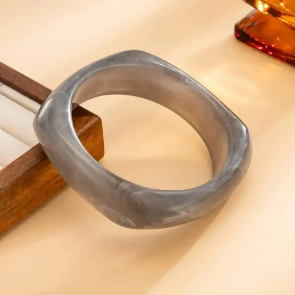 S9acc93c410a14e07ba5e4125a63de4deq.webp Urban Edge Modern Chunky Bangles Set in Textured Metal and Resin