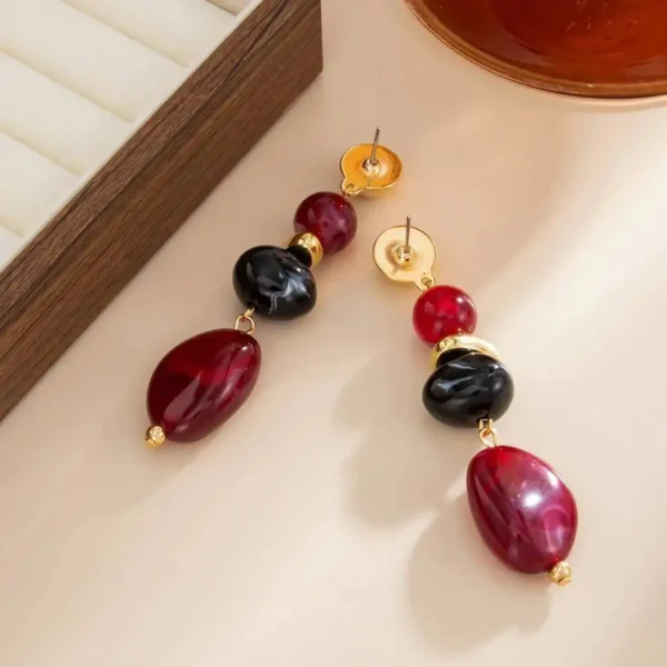 S9d553aed47194b95bebf4d10da734e14e.webp Boho Earrings with Bold Stone Accents and Gold Highlights