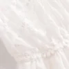 S9f38f0c4d1184531a02d442bb3c1642bx.webp Dreamweaver White Bohemian Lace Maxi Dress with Sheer Overlay