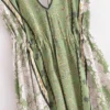 Sa27cb5a82c8e4d05a1a815874ed9bab1L.webp Desert Bloom: Floral Print Backless Halter Maxi with Tassel Hem
