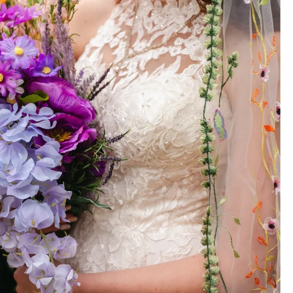 Sa537aa39e59d44c3a01f607b5950b222q.webp The Honeyblossom Veil, a wildflower wedding veil embroidered all over with poppies, daisies and ferns