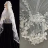The Elsie Cap, a cream white juliet cap veil with 3D fabric flowers, pearls and a lace-edged tulle veil