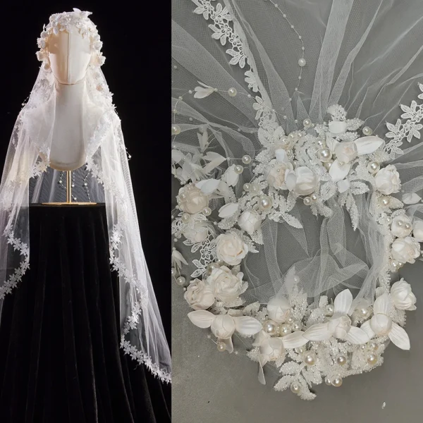 The Elsie Cap, a cream white juliet cap veil with 3D fabric flowers, pearls and a lace-edged tulle veil