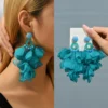 Sab57d1b4714e42f2981cad5540f1d7e5J.webp Radiant Blooms Floral Statement Earrings with Layered Petals