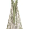 Sb10e6510b4e8428e8feea3d867d4223fa.webp Desert Bloom: Floral Print Backless Halter Maxi with Tassel Hem