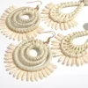 Sb300dcdf61164275bb644907084eb78fN.webp Circular woven raffia statement earrings with spiral centre