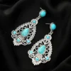 Sc07b8cfe31f04d60a1af740dcd22620cz.webp Intricate Silver Boho Earrings with Turquoise Accents