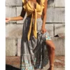 Sc1b54bd062ee40e7866fb339b125cfa64.webp Harmony Flows Bohemian Floral Maxi Skirt with Tiered Design
