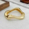 Sc5ca8f2e800a46158a88c07ea7359d50r.webp Urban Edge Modern Chunky Bangles Set in Textured Metal and Resin