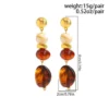 Sc6b8db3a14ce45e1a13ac31f341782e70.webp Boho Earrings with Bold Stone Accents and Gold Highlights