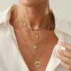 Sccaa56876d6148c39475da625692536ed.webp Elements Lost and Found Gold Layered Necklace with Turquoise Details