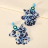 Sccafe5c9f029416181deac9a5d9bb7faI.webp Radiant Blooms Floral Statement Earrings with Layered Petals