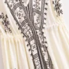 Sd132cca44a6d4ba1ab01b5b3df8fd2b7K.webp Desert Bloom: Floral Print Backless Halter Maxi with Tassel Hem