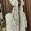 Sd32a6ba7ef6e49bf823590f3139ff7ddf.webp Timeless Elegance Long Lace Bow Bridal Veil