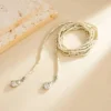 Sd97e2ce7621842f194371883efaa8d27G.webp Ethereal Echoes Layered Beaded Necklace with Adjustable Length