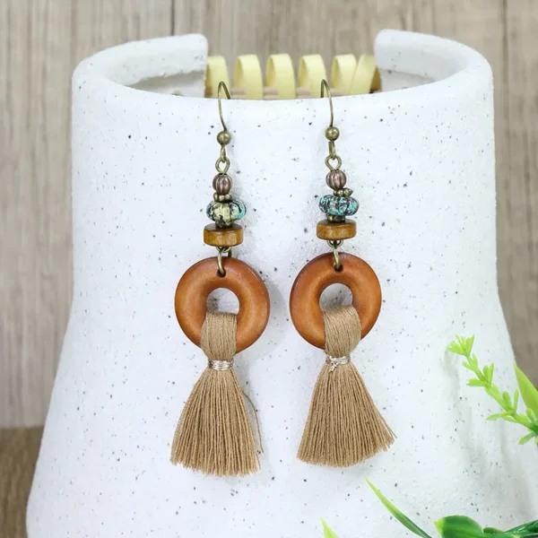Sdd8ab1fb14aa474ab93b72f3a26ad3ad0.webp Odyssey Dangle Boho Tassel Earrings with Geometric Metal Accents