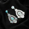 Sdfeae2db3afc45c0aaa2aba641162600o.webp Intricate Silver Boho Earrings with Turquoise Accents