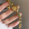 Se40e0230ecf54f51a56eff85e812f016J.webp Elysian Gemstone Embellished Wristwatch with Bracelet Strap