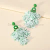 Se8b2c9904fd14d16a7f6cc46ef45e0d43.webp Radiant Blooms Floral Statement Earrings with Layered Petals