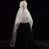 The Elsie Cap, a cream white juliet cap veil with 3D fabric flowers, pearls and a lace-edged tulle veil